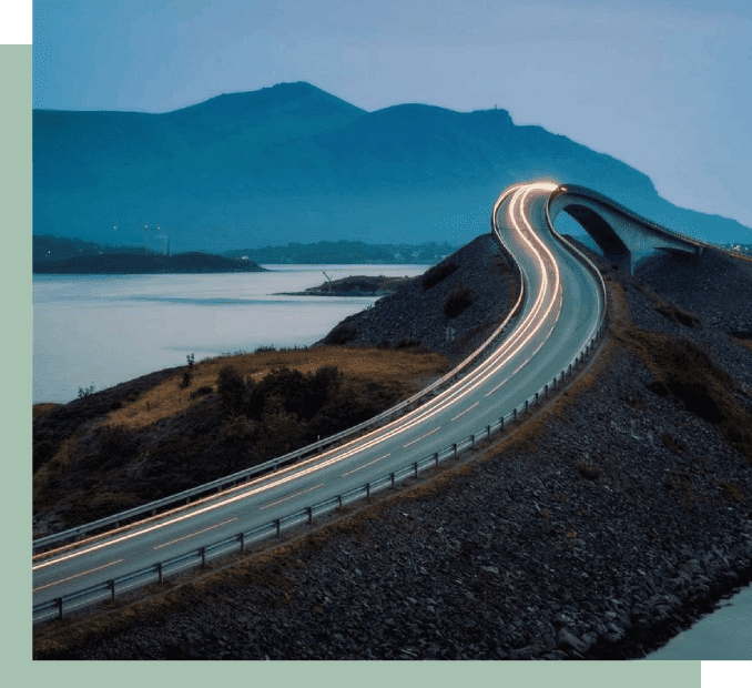 A road going over the side of a mountain.